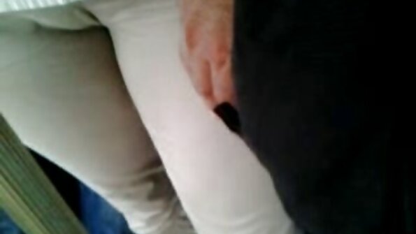 Two women are kissing each other while they are riding a dick