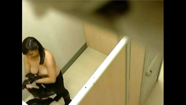 Two chicks are pushing their bodies together in the 69 position